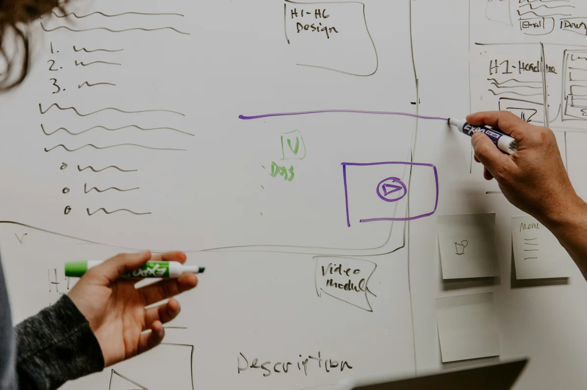 SEO strategy planning session illustrated on a whiteboard SEO strategy planning session illustrated on a whiteboard